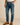 "Men’s name-brand blue denim jeans styled with brown leather dress shoes and white t-shirt, casual outfit for everyday wear, displayed on model against neutral background