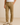 Men’s name-brand khaki pants styled with white t-shirt and beige suede dress shoes, casual-smart outfit for everyday or office wear, modeled against neutral background