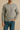 "Men’s heather gray crewneck sweatshirt paired with name-brand blue jeans, casual fall fashion modeled against a neutral background."